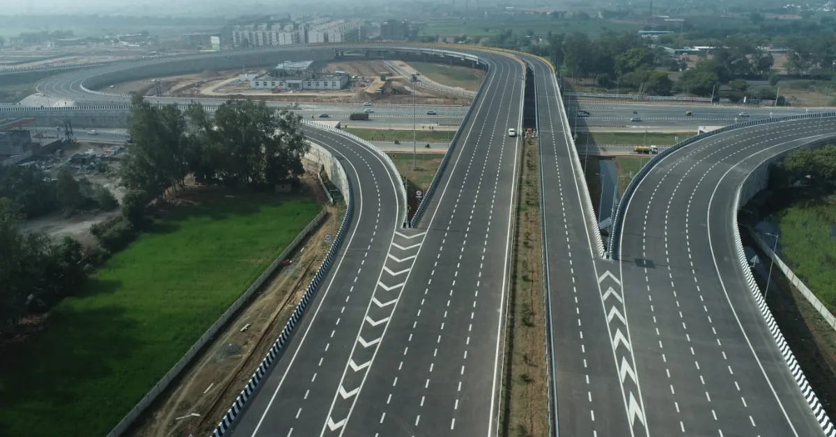 Delhi-Mumbai Expressway showing multi-lane highway infrastructure across a rural landscape