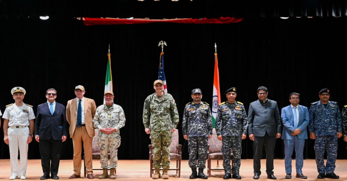 Multinational naval officers during command ceremony linked to Combined Task Force 154