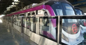 Delhi Metro Magenta Line driverless train at an elevated station platform