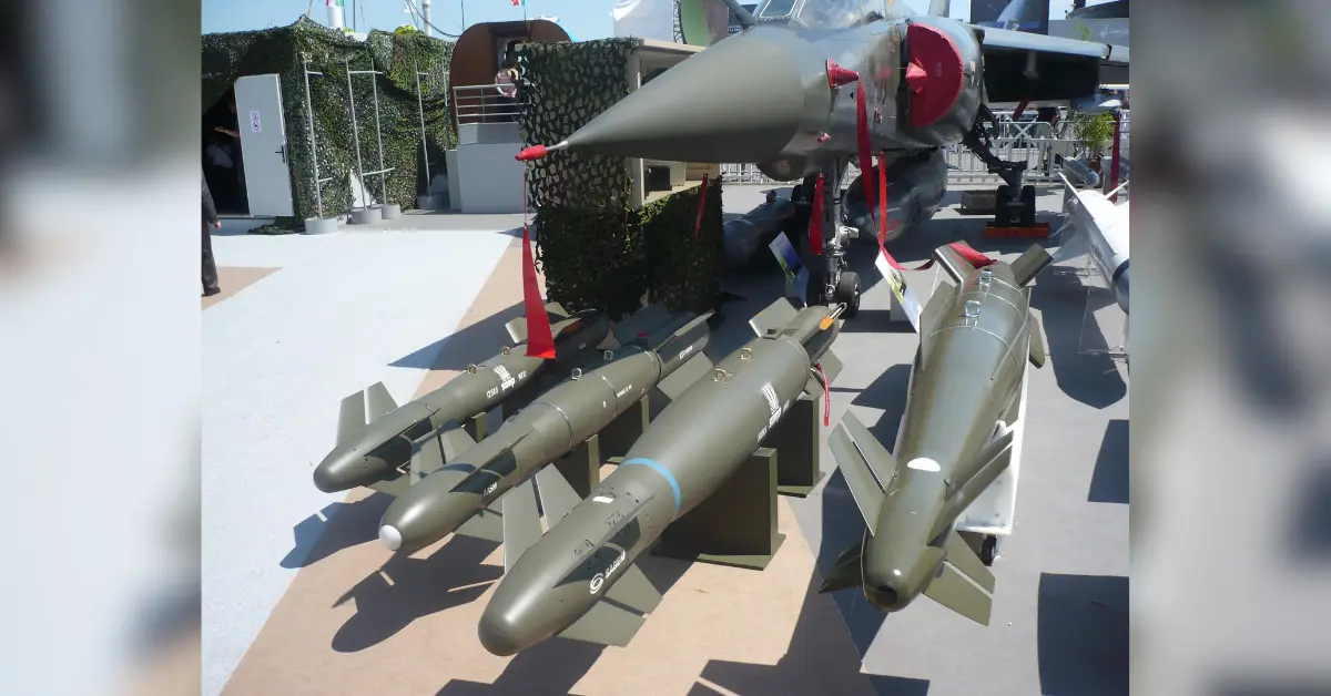 HAMMER missile production system displayed under fighter aircraft at defence exhibition