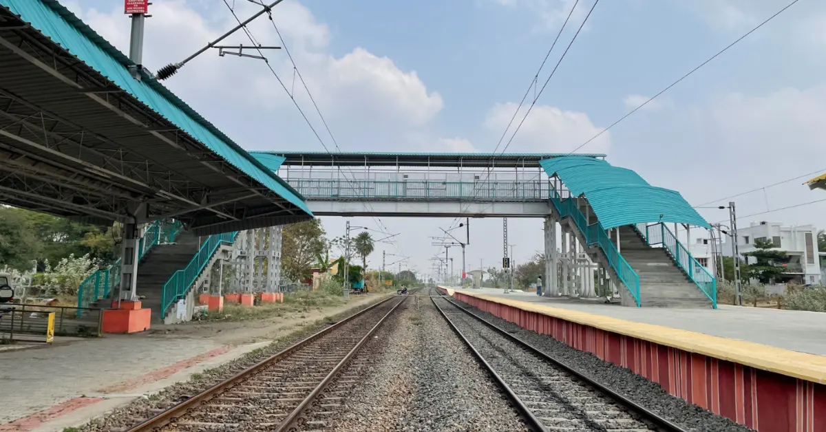Indian Railways station infrastructure showing doubled tracks and electrified corridor