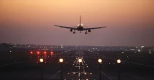 Aircraft landing on a runway representing regional air connectivity under India’s UDAN network
