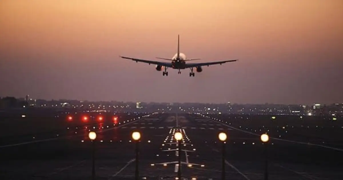 Aircraft landing on a runway representing regional air connectivity under India’s UDAN network