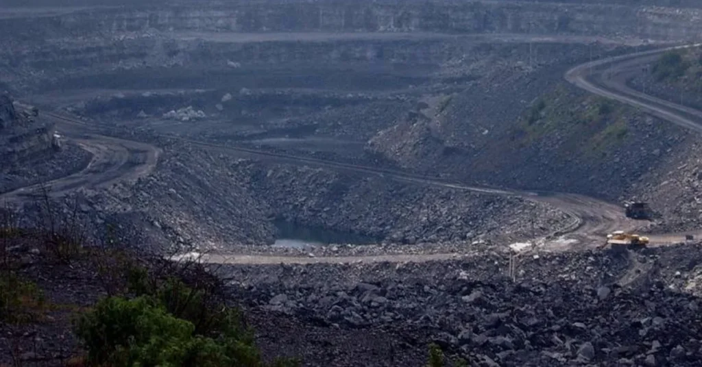 India’s coal output open pit coal mine with heavy machinery and excavation activity