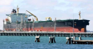 Indian oil tanker transporting crude oil at a port terminal
