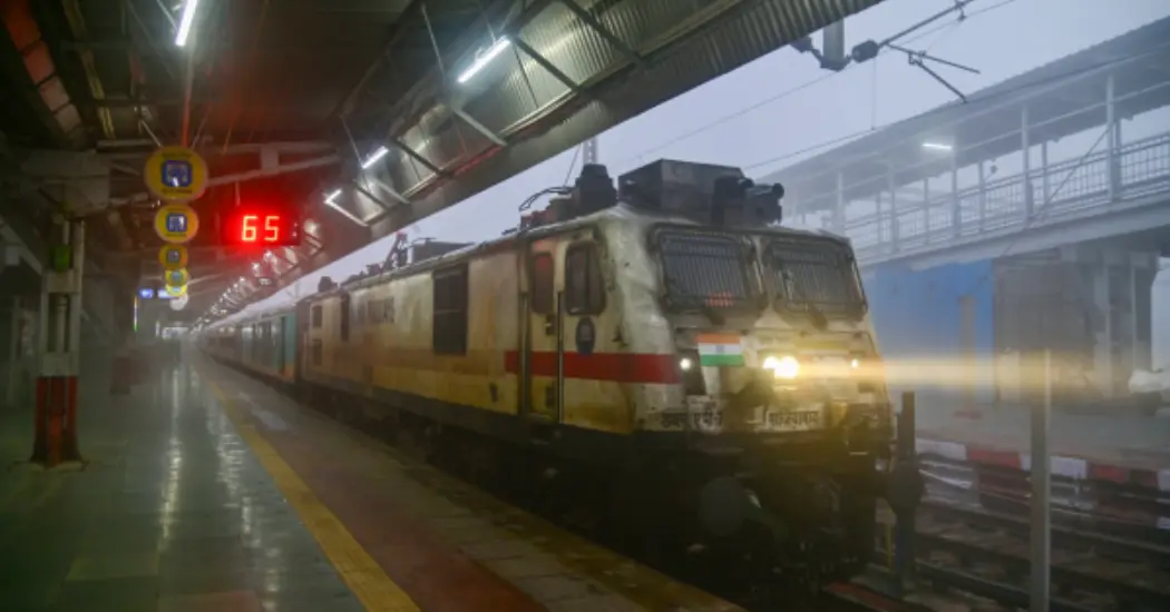 Indian Railways train at station representing rail infrastructure upgrades in India