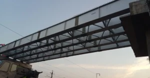 Under-construction Road Over Bridge above electrified Indian Railways tracks