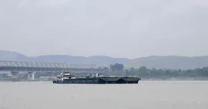 Cargo vessel transporting goods via Indo-Bangladesh Protocol Route near Pandu in Guwahati