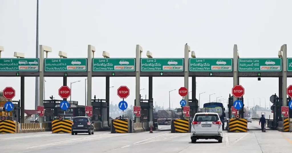 Vehicles passing through a toll plaza on a National Highway.