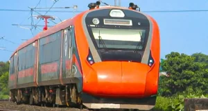 Vande Bharat Trains at railway station with passengers boarding