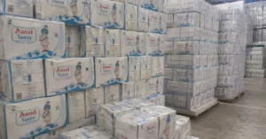 Ahmedabad Division Amul milk cartons stacked in warehouse for railway cargo transport