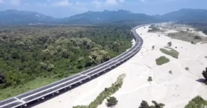 Delhi-Dehradun Expressway elevated corridor passing through forest and riverbed landscape