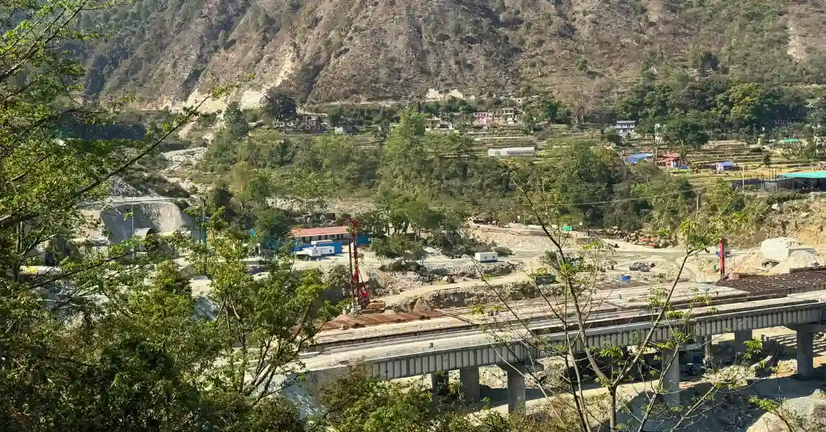 Rishikesh-Karnaprayag rail line construction site in Karnaprayag showing bridge and tunnel works in Himalayan terrain