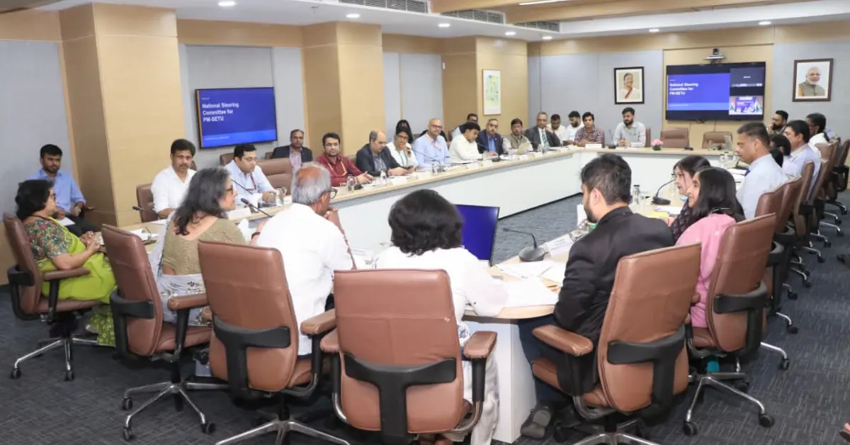 A conference room filled with officials and stakeholders attending the National Steering Committee meeting under the PM-SETU scheme.
