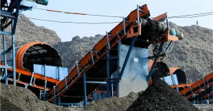 Biomining and waste processing machinery at Bhalswa landfill in Delhi