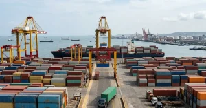Shipping containers at a busy seaport terminal