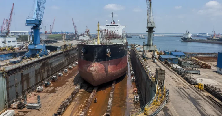 Commercial vessel undergoing repairs at Vadinar shipyard infrastructure