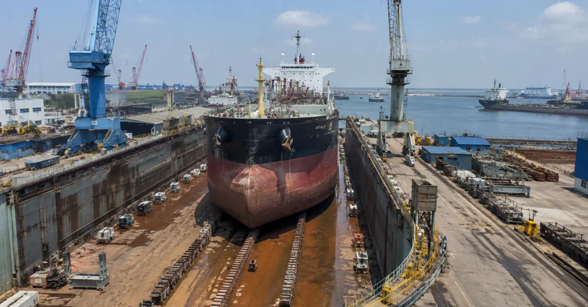 Commercial vessel undergoing repairs at Vadinar shipyard infrastructure