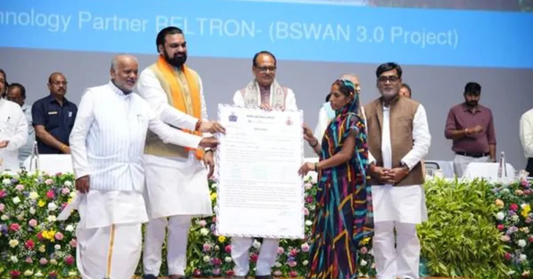 The Infra Post - India's Leading Infrastructure News Platform 14 PMAY-G beneficiary receiving a housing sanction document during a government programme in Bihar