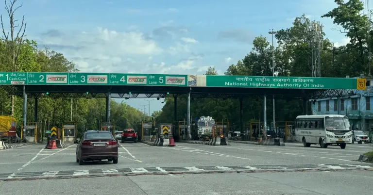 FASTag Local Pass infographic showing 121 toll plazas and 20 km local eligibility
