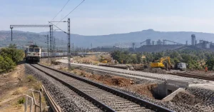 Railway infrastructure and industrial landscape representing rail capacity expansion in Maharashtra