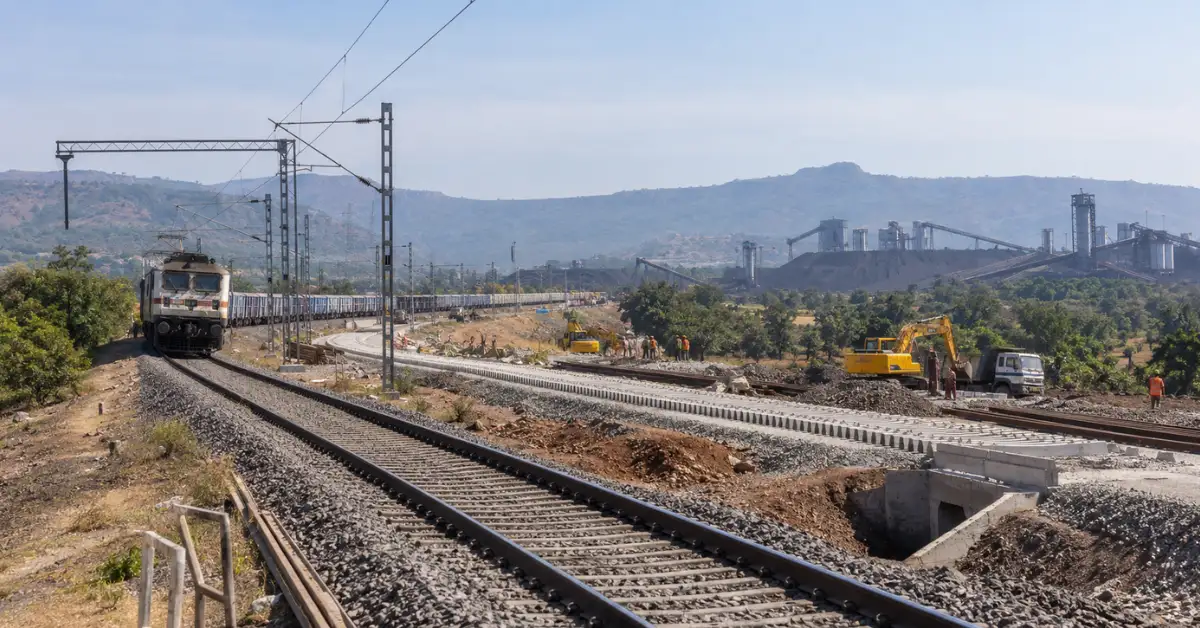 Railway infrastructure and industrial landscape representing rail capacity expansion in Maharashtra