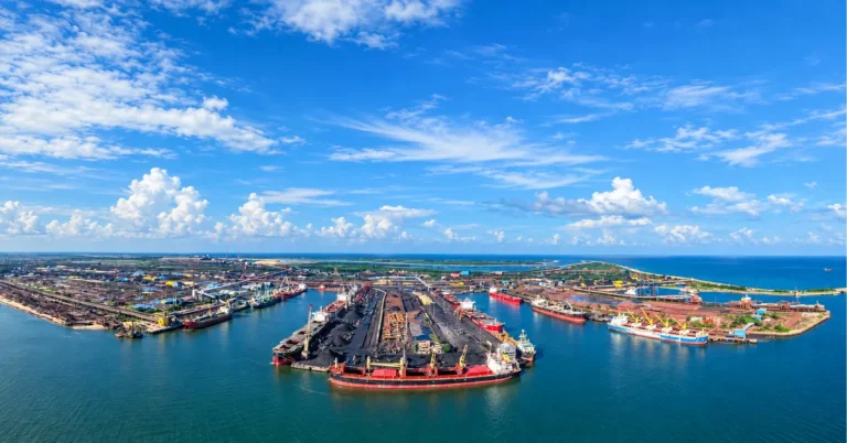 Large Indian commercial port with cargo berths ships and maritime infrastructure