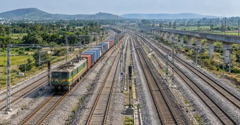 Indian Railways multitracking corridor with a freight train and multiple railway lines