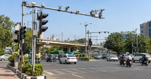 Adaptive traffic signals and traffic cameras at a busy Delhi road intersection