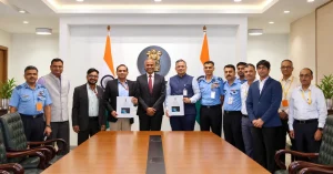 Ministry of Defence officials and Indian Air Force representatives pose with contract documents during a defence procurement ceremony in New Delhi.