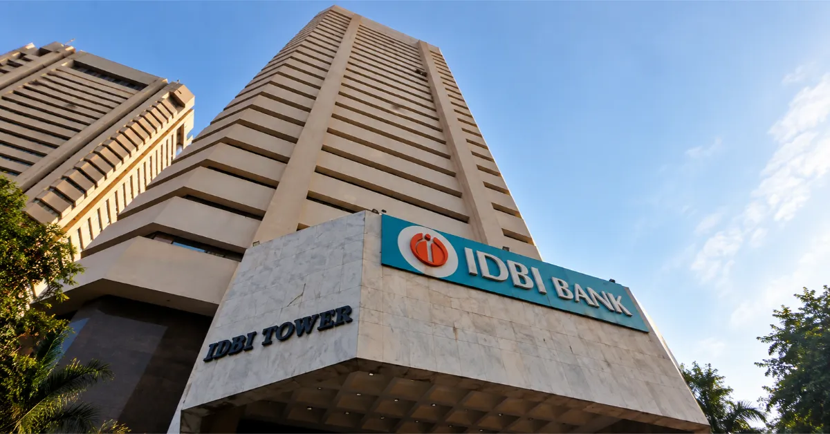 The Infra Post - India's Leading Infrastructure News Platform 1 Low-angle exterior view of IDBI Tower with prominent bank signage, accompanying coverage of the IDBI Bank stake sale and government ownership clarification.